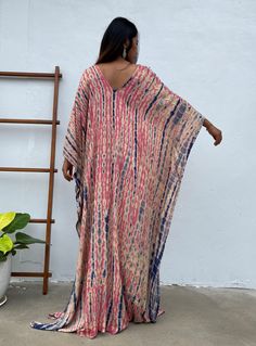 Dive into a world of vibrant color and unique patterns with our tie dye kaftan. Each piece is a masterpiece of individual hand tie-dyeing, ensuring that no two are alike. Crafted with meticulous care and attention, these kaftans offer a burst of style and creativity. Whether you're lounging at home, heading to the beach, or stepping out for an evening on the town, our tie dye kaftan is the perfect choice to make a bold and unforgettable fashion statement. Embrace the artistry and individuality o Latest Kaftan Designs, Pink And Blue Tie Dye, Plus Size Caftan, Blue Caftan, Tie Dye Kaftan, Kaftan Designs, Ankara Gown Styles, Long Kaftan, Hand Tie