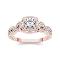 a rose gold engagement ring with diamonds on the band and an oval center stone in the middle