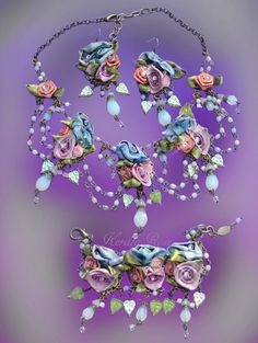 "This ornate parure necklace, bracelet and earring set is made with hand-painted ribbon roses decorated with rhinestone centers.  Czech glass leaf beads dangle with White Opal crystal teardrops.  The necklace drapes to cover the chest. The back is joined with a lobster claw and extension chain.   It measures about 10\" long.  Comes with matching earrings and bracelet.  The earrings are 4\" long and the bracelet is 8\" with extension chain.  The roses are slightly stiffened with a clear sealer, t Fairytale Jewelry, Fairy Tale Jewelry, Fantasy Necklace, Leaf Beads, Ribbon Rose, Bridal Accessories Jewelry, Jewelry Hand, Ribbon Roses, Romantic Flowers