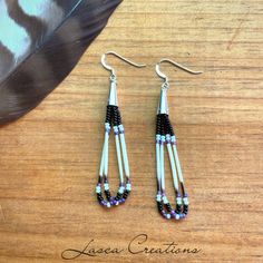 the earrings are made with beads and feathers