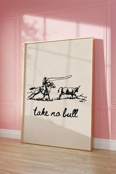 there is a picture frame on the floor in front of a wall that says take no bull