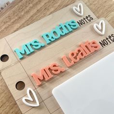 two magnets with the words mr and mrs leaks on them, sitting next to each other