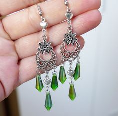 "Green crystal spike long dangle earrings with rubber backs. Length from end to end: 9cm, 3.5\" Earring hook material: 316 l stainless steel Crystal color: green Crystal spike size: 16 x 6mm This listing is for the crystal spike earrings shown in the pictures. These earrings will come in a gift bag. I offer combined shipping costs which give you a shipping discount for ordering multiple items from my shop. See more chain/cord/wire click here: http://etsy.me/2qSGJ6b Don't forget to purchase the m Green Crystal Earrings, Green Dangle Crystal Earrings, Green Crystal Earrings For Jewelry Making, Green Nickel Free Dangle Chandelier Earrings, Green Nickel-free Dangle Chandelier Earrings, Green Teardrop Chandelier Earrings Nickel Free, Green Teardrop Nickel-free Chandelier Earrings, Green Teardrop Crystal Earrings Pierced, Crystal Spikes