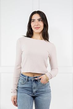 The Phoebe Long Sleeve Crop Top from By Together is the perfect essential top to add texture to any outfit! This soft and stretchy top features a rounded neckline, ribbed fabric and long fitted sleeves. Its lightweight feel makes it perfect for layering under an oversized tee or for wearing on it's own with your favorite pair of straight leg denim! Fabric: 63% Polyester, 33% Rayon, 4% Spandex Measurements: Bust(Size M): 15'' Length (Size M): 16.5'' True To Size Fit S 0-6 M 6-10 L 10-14 Ladies Of Denim Jacket Short, M 16, Fitted Sleeves, Denim Joggers, Stretchy Tops, Graphic Tops, Tall Girl, Boot Cut Denim, Rounded Neckline