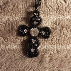 This Beautiful Black Cross Has Rhinestones On It. The Delicate Black Chain That It Hangs On Is 20" Long. This Would Make A Perfect Gift. The Cross Measures 1" X 1". All Of My Items Are From A Smoke Free Pet Friendly Home. Black Rhinestone Costume Jewelry Necklace, Black Metal Necklace With Rhinestones, Elegant Cross Rhinestone Necklace For Parties, Elegant Cross-shaped Rhinestone Necklace For Parties, Elegant Adjustable Black Rhinestone Necklace, Elegant Black Adjustable Rhinestone Necklace, Black Costume Jewelry With Rhinestones, Elegant Black Jeweled Necklaces, Black Rhinestone Costume Jewelry