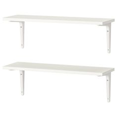 two white shelves sitting next to each other