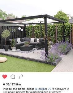 an outdoor living area with furniture and plants