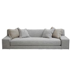 a gray couch with some pillows on it