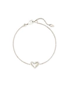 Wear your heart on your wrist with the Ari Heart Chain Bracelet. This asymmetrical design shines solo, but functions just as well as part of your everyday stack.Material: Dichroic GlassClosure: Adjustable lobster claw Closet Vision Board, Silver Kendra Scott, Playful Jewelry, Heart Chain, Silver Chain Bracelet, Kendra Scott Jewelry, Athletic Outfits, Heart On, Heart Bracelet