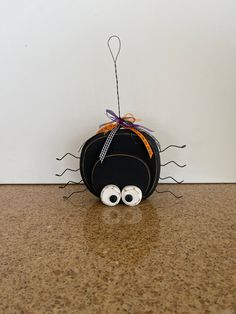 a black bag with googly eyes on it