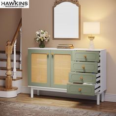 a green and white cabinet with drawers next to a stair case in a living room