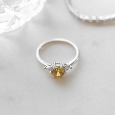 Beautiful dainty Canary Diamond ring. Symbolic of wisdom, long-lasting happiness and love, this ring would be perfect as a promise, engagement, or wedding ring! Made of 925 Sterling Silver THICK plating of 14k Gold or Rhodium Available in Sizes 4-10 Canary diamond size: 6mm Made of highest quality cubic zirconia VERY HIGH QUALITY Nickel-free & Hypoallergenic - will NOT turn fingers green! Ring Sizer Dainty Cubic Zirconia Crystal Ring For Proposal, Cubic Zirconia Midi Rings For Promise, Anniversary Midi Rings With Prong Setting, Yellow Topaz Promise Ring, Round Cut, Fine Jewelry Yellow Promise Ring, Classic Cubic Zirconia Midi Rings For Anniversary, Yellow Promise Ring Fine Jewelry, Yellow Fine Jewelry Promise Rings, Yellow Promise Rings In Fine Jewelry Style