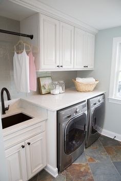 a washer and dryer in a small room