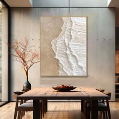 a dining room table with chairs and a painting on the wall