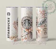 three starbucks coffee cans are shown side by side on a white surface with flowers and leaves painted on them