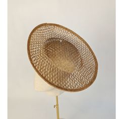 One woven sinamay straw hat base in toast / warm brown that measures approximately 12" (30.48cm) in diameter. The edges of the brim are finished in wired sinamay. The multi-layer stiffened woven sinamay straw has a great sturdy weave and provides excellent support for your millinery creations. This is NOT a ready to wear finished hat and will not stay on your head unless you add a head band or elastic to wear. Add embellishments of your choice. A nice high quality base - I know you'll be pleased! This hat base is listed separately in several different colors. See last photo and check my listings for those... Lots of hat bases and millinery supplies listed in my shop   www.etsy.com/shop/apinkswan  ! Thanks for looking - feel free to convo me with any questions you may have. Gold Straw Hat With Flat Brim, Gold Straw Brimmed Hat, Gold Fedora Straw Hat For Kentucky Derby, Brown Woven Fedora Straw Hat, Brimmed Brown Straw Hat, Brown Woven Straw Hat With Curved Brim, Gold Brimmed Straw Hat, Brown Woven Straw Hat, Gold Wide Brim Straw Hat