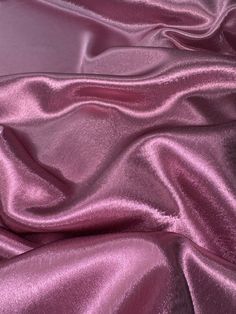 Dusty pink crepe back satin This high-quality satin fabric is a perfect choice for any project that requires a touch of elegance and sophistication. The 58-inch width make it suitable for a wide range of applications, from apparel to home decor and crafts. The fabric comes in a beautiful shade of silver, which adds a classy and luxurious feel to any design. Ideal for use in bridal dresses, blazers, curtains, and even marquees, this shiny crepe back satin fabric offers excellent drape and durability. Whether you are a professional designer or a DIY enthusiast, this fabric is sure to inspire your creativity and help you create stunning and unique creations. Get your hands on this gorgeous fabric today and let your imagination run wild! Delivery All items are dispatched within 1-2 working day Crushed Velvet Fabric, Deco Dress, Shiny Fabric, Pink Lavender, Metallic Pink, Gorgeous Fabrics, Crushed Velvet, Dusty Pink, Satin Fabric