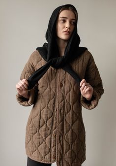 Introducing the all natural quilted outerwear collection. We sourced a beautiful range of linens and cottons to create a warm and structured coat to layer up or down as the weather cools. Designed with a mid length oversized fit, two front pockets, and tonal corozo nut buttons. 100% Linen Outer100% Cotton fill100% Organic Cotton lining100% Cotton labels/ Corozo nut buttons Dry Clean Only. Made in India by our Fair Trade Certified partners. Model in studio is 5'9" and wears a Small.Model at beach Linen Outer, Quilted Outerwear, Triangle Shawl, Beautiful Range, Sea Ny, Cotton Labels, Triangle Shawls, Denim Hat, Norse Projects