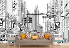 a couch sitting in front of a wall with city buildings on it's sides