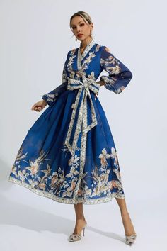 The Miley Blue Floral Belted Long Sleeve Dress is a timeless piece that exudes elegance. With a retro-inspired wrap design, this dress is perfect for any occasion. Its floral print adds a touch of femininity, while the belted waist enhances your silhouette. Made from high-quality materials, this long sleeve dress is both comfortable and flattering. Whether you're attending a formal event or a casual outing, this dress will make you stand out in style.  Dress Length: Approx 132cm Materials: Polye Wrap Dress Formal, Blue Wrap Dress, Touch Of Gold, Product Images, Style Dress, Retro Inspired, True Colors, Timeless Pieces, Formal Event