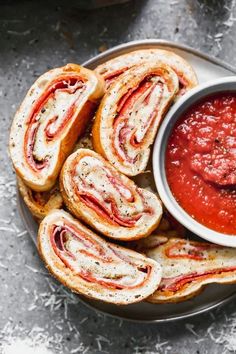 a plate with some bread and sauce on it