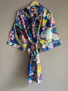 This kimono is made very neatly, and the matching strap has also been used in almost many places in the kimono, which makes the kimono very much. giving a beautiful look It looks good in the photo, but it looks great after wearing this kimono 100% Soft Cotton Hand Block Print Fabric Robe. The perfect to cover up your dance costume, to use for a dinner party or just slip into in on a beautiful summer morning. This particular beauty has a Japanese feeling to it. Cotton kimono robes are perfect for lounging around the home or spa. Use our Floral Hand block print robe :) Measurements: Size: Short & Free Size/ Plus Size Bust Approx: 120 CM ( 47 inch ) Length:100 CM ( 39 inch ) :) Fabric: 100% Pure Soft Cotton Fabric :) 2 Side Pockets :) Color: Multi-color as Shown in Image. Note: Due to Differe Kimono Robes, Block Print Fabric, Summer Morning, Printed Robe, Cotton Kimono, Bridesmaid Robes, Hand Block Print, Block Printing Fabric, Womens Robes