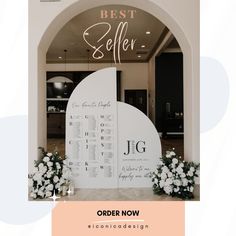 the best seller sign is displayed in front of an archway with flowers and greenery