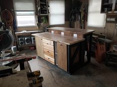 a workbench in a garage with lots of tools