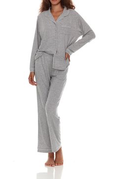 A matching pajama set crafted from a luxurious satiny knit ensures even your bedtime wardrobe is chic! 29" inseam (size Small) Two-piece set Top has front button closure 62% polyester, 33% rayon, 5% spandex Machine wash, tumble dry Imported Model stats: 5'10" height, 32" bust, 25" waist, 36" hip. Model is wearing size Small. Matching Pajama Set, Flora Nikrooz, Matching Pajama, Matching Pajamas, Heather Gray, Pajama Set, Heather Grey, Pajamas, Two Piece