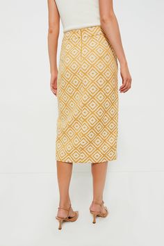 The Marigold Tweed Margo Skirt is as chic as it gets! This midi features an asymmetric hemline, a sophisticated column silhouette, and a textured stitched fabric that is sure to turn heads. Style with a white button-down and heels for the office, or with the matching Marigold Tweed Clara Shirt Jacket for a set that can be worn to dinner parties, luncheons, and showers alike! Mid rise Center back zipper Crossed front Asymmetrical hem Midi length Lined Material: 100% Polyester (outer), 100% Cotton Chic Knee-length Gold Skirt, Gold Chic Midi Skirt, Chic Gold Midi Skirt, Cocktail Attire, Whale Tail, White Button Down, Weekend Wear, Night Looks, Dinner Parties