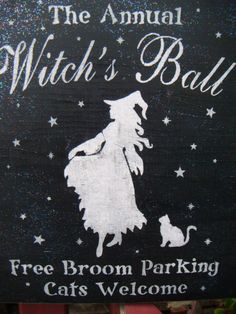 a sign that says the annual witch's ball free broom parking cats welcome on it