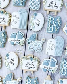 baby shower cookies are arranged on a table