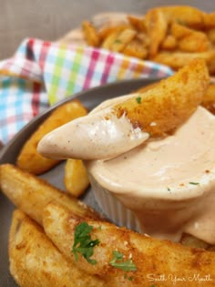 a plate with french fries and dipping sauce