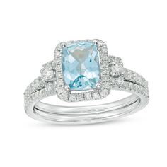 This 1/2 ct. t.w. diamond frame bridal set in 14K white gold features an 8.0 x 6.0mm cushion-cut aquamarine center stone engagement ring. Additional diamonds line the ring's shank and coordinating wedding band. Emerald Cut Light Blue Jewelry For Weddings, Light Blue Diamond Jewelry With Accent Stones, Light Blue Emerald Cut Wedding Jewelry, Light Blue Emerald Cut Jewelry For Wedding, Wedding Jewelry With Light Blue Center Stone, Light Blue Diamond Wedding Jewelry, Light Blue Diamond Accented Jewelry For Anniversary, Light Blue Wedding Jewelry With Center Stone, Light Blue Jewelry With Center Stone For Wedding