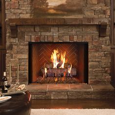 a fire place in a living room with a painting on the wall