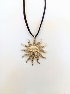 Brass pendant,pendant in shape of Sun, symbol of happiness.Sun smile,Pagan fortune talisman,gift for girl,woman.Jewelry.Handmade, for dear Pendant in the shape of the Sun. It is made of raw, 100% natural brass. The strap made of brown leather. The Sun is symbol of happiness, well-being and fortune. This charming pendant could be a wonderful gift for everyone who likes jewelry made of brass. The pendant ships in a gift box. Made with love for you! If you have any questions regarding this item, pl Spiritual Sun Design Jewelry For Festival, Symbolic Sun Design Jewelry For Gifts, Spiritual Sun And Moon Design Jewelry, Bohemian Sun Shaped Jewelry Gift, Yellow Amulet Necklace As Gift, Handmade Sun-shaped Necklace For Gifts, Spiritual Sun Design Jewelry, Adjustable Spiritual Necklace With Sun Design, Nickel-free Sun-shaped Jewelry Gift