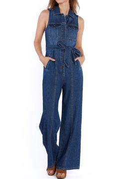 Brassy buttons and sweeping wide legs add character to a fitted denim jumpsuit equipped with handy side pockets. 60" length Front button closure Point collar Sleeveless Chest button-flap patch pockets; side-seam pockets Removable tie belt Unlined 100% cotton Machine wash, tumble dry Imported Dark Wash Utility Denim Jumpsuit With Bib Front, Utility Style Dark Wash Denim Jumpsuit With Bib Front, Denim Blue Overall Jumpsuit With Button Closure, Dark Wash Wide Leg Jumpsuits And Rompers With Pockets, Utility Style Denim Blue Bib Front Jumpsuit, Utility Denim Blue Jumpsuit With Bib Front, Utility Denim Jumpsuit With Buttons In Medium Wash, Utility Style Denim Jumpsuit With Buttons, Utility Denim Jumpsuits And Rompers With Button Closure