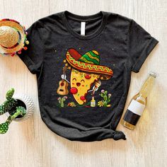 Happy Cinco De Mayo Pizza Shirt, Mexican Pizza Slice Shirt Casual T-shirt With Funny Print For Cinco De Mayo, Multicolor Crew Neck Shirt For Cinco De Mayo, Casual Short Sleeve Shirt For Cinco De Mayo, Cotton Tops With Graphic Print For Cinco De Mayo, Cinco De Mayo Black Graphic T-shirt, Cinco De Mayo Graphic T-shirt, Cinco De Mayo Graphic Cotton T-shirt, Cinco De Mayo Funny Print Cotton Tops, Cinco De Mayo Graphic Tee With Short Sleeves