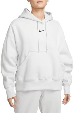 Supersoft fleece means all-day comfort in a dropped-shoulder hoodie perfect for relaxing at home or heading to the gym. Drawstring hood 80% cotton, 20% polyester Machine wash, line dry Imported Nike Sportswear Phoenix Fleece, Matching Sweats, Nike Blazer Mid 77, Nike Sweatshirts, Oversized Pullover, Nike Blazer, Nike Hoodie, Workout Hoodie, Sportswear Women