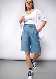 A sure-to-be closet classic, our Wide Leg Short is the adaptable piece your outfits have been waiting for. In a comfortable fabric, this ultra versatile piece can be dressed up, down, and in-between for whatever style you're feeling. Pair with a flowy button-up for a comfy cool look or top it with a vest for a new take on suiting. FIT + FEATURES 74% Polyester, 24% Rayon, 2% Spandex High rise fit. Knee length wide leg.   Tab front closure with interior button Zipper fly Double pleated front 2 sid Casual Outerwear For Work, Gender Neutral Clothes, In Between, Summer Staples, Summer Shorts, Summer Outfit, Knee Length, How To Look Better, Wide Leg