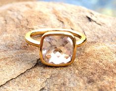 April Birthday, April Birthstone Ring, Clear Stackable Ring, Square April Ring, Gold Clear Crystal Ring, April Birthstone Jewelry The square, cushion cut stackable ring has a gem size of 9mm. The finish is vermeil, 24kt. Gold over a Sterling Silver base. More gemstone rings in my store: https://www.etsy.com/shop/PhaedoraJDesigns?section_id=17141549&ref=shopsection_leftnav_4 Gold Topaz Ring With Large Stone As Gift, Gold Topaz Ring With Rectangular Stone For Gift, Blue Topaz Ring For Gift, Crystal Ring With Rectangular Gemstone For Gift, Rectangular Gemstone Crystal Ring Gift, Rectangular Crystal Gemstone Ring For Gift, Adjustable Crystal Ring With Large Stone For Gift, April Birthstone Ring, Herkimer Diamond Ring