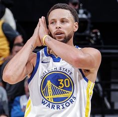 the golden state warriors'stephen curry reacts to his team's win over the san antonio spurs