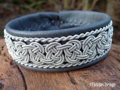 "Braided spun pewter silver thread, carefully hand stitched on reindeer leather or lambskin, and completed with a carved reindeer antler closure. Width: approx. 2 cm (0.8\"). Ships in a nice handmade gift box. Design: BEOWULF - Hero warrior and king of the Geats (North Germanic tribe), defeater of the monster Grendel. LEATHER COLORS AND STYLES: Please see last photo - 30 colors to choose from. SIZE: Please measure your wrist and add 1 cm (0,4\"), for a perfect snug fit. The soft leather will str Handmade Leather Silver Bracelets, Handmade Silver Leather Bracelets, Handmade Leather Silver Bracelet, Handmade Silver Braided Bracelets For Festival, Silver Artisan Leather Bracelet As Gift, Artisan Silver Leather Bracelet For Gift, Silver Artisan Leather Bracelet For Gift, Artisan Silver Leather Bracelet Gift, Silver Leather Cuff Bracelet For Festivals