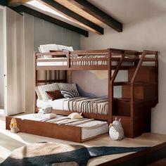 a bunk bed with drawers underneath it in a room