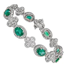 Exquisite and elegant emerald and diamond bracelet. 13.25 carats total gemstone weight. 8 oval cut emeralds, approximately F2, 8.27 carats. Complimented by 347 round brilliant diamonds, 4.98 carats. Approximately G/H color and SI clarity. 18k white gold, 14.92 grams, 7 inches. Accommodated with an up to date appraisal by a GIA G.G. upon request. please contact us with any questions. Item Number B3776 Formal Jewelry, Modern Bracelets, Emerald Diamond, G H, Up To Date, Oval Cut, Round Brilliant, Diamond Bracelet, Jewelry Bracelets