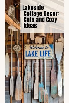 wooden spoons and paddles are hanging on the wall next to a sign that says lakeside cottage decor cute and cozy ideas