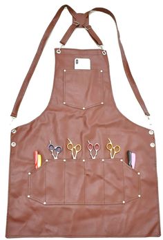 a leather apron with scissors and pencils on it