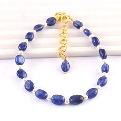 Natural Blue Sapphire Fresh Water Pearl Beads Sapphire Gemstone Beads Blue Sapphire Beads 7 Inch Bracelet Product -; Blue Sapphire Grade-: AAA High Quality Stone shape-: Faceted Beads Shape Color= blue Length-: 7 Inch Quantity -: 1 Strand Size-: 5/7 MM Genuine Measurements and weight are close to approximations We accept bulk or wholesale orders for any gemstone which you'll get best wholesale prices! Hence you can contact me with your requirement of bulk or wholesale order. I'll be happy to ful Blue Pearl Bracelet With Gemstone Beads For Gift, Blue Pearl Bracelet With Gemstone Beads As A Gift, Blue Hand-strung Pearl Bracelet With Round Beads, Blue Pearl Bracelet With Natural Round Beads, Blue Pearl Bracelet With Natural Stones, Sapphire Beaded Bracelets With Natural Round Beads, Adjustable Blue Pearl Bracelet With Natural Stones, Blue Oval Beads Bracelets As Gift, Blue Beaded Bracelets With Faceted Oval Beads