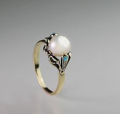 "14K Gold ring delicate detailed with real round pearl and 2 small turquoise . vintage victorian design I make it any size you want. weight : 3.1 gram gemstone size : main pearl - 7 m\"m worldwide free shipping." Vintage Cabochon Pearl Ring For Wedding, Antique 14k Gold Pearl Wedding Ring, Elegant Turquoise Cabochon Ring, Fine Jewelry Turquoise Wedding Ring, Fine Jewelry 14k Gold Turquoise Wedding Ring, Fine Jewelry 14k Gold Turquoise Ring For Wedding, Gold Turquoise Ring For Wedding, Fine Jewelry, Gold Turquoise Ring For Wedding, Handmade Vintage Opal Ring For Wedding