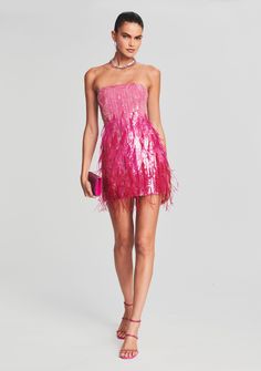 Let loose in our Anastasia Dress — a playful mini that will make any moment memorable. The shimmering dress features fuchsia sequins and airy feather embellishments throughout. The strapless silhouette is designed with supportive boning through the bodice to contour the curves of the body and is finished with an invisible zip closure. Shown here in Fuchsia. HANDMADE Self: 95% Polyester, 5% Lycra, Trim: 100% Ostrich Feather Made in India Model is 5'11" wearing size XS Style No. SS21-3507 Sequin Bachelorette Party Outfit, Sequin Feather Dress, Eras Fits, Feather Party, Shimmering Dress, Anastasia Dress, Easter Dresses For Toddlers, Australia Clothes, Fuschia Dress